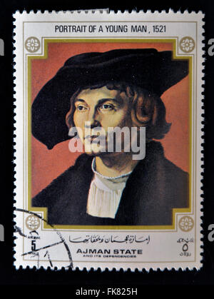 AJMAN - CIRCA 1970: Eine Briefmarke gedruckt in Ajman zeigt Porträt des jungen Mannes, von Albrecht Dürer (1471-1528), ca. 1970 Stockfoto