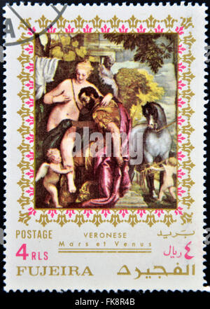 FUJEIRA - ca. 1985: Briefmarke gedruckt in Fujeira zeigt Mars und Venus vereint durch die Liebe von Paolo Veronese, ca. 1985 Stockfoto