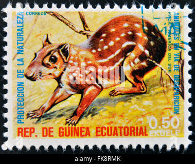 ÄQUATORIAL GUINEA - CIRCA 1974: Briefmarke gedruckt in Guinea gewidmet vom Aussterben bedrohte Tiere, Shows Tiefland Paca, Südamerika Stockfoto