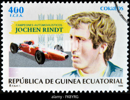 ÄQUATORIAL GUINEA - ca. 1995: Eine Briefmarke gedruckt in Guinea Auto Meister gewidmet zeigt Jochen Rindt, ca. 1995 Stockfoto