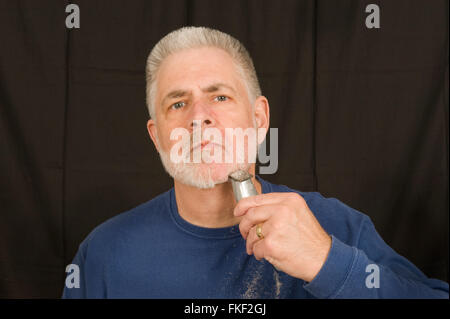 Den Bart abnehmen Stockfoto