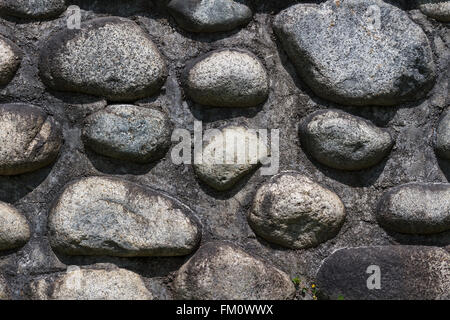 Hintergrund der eine Nahaufnahme von einer Mauer mit Kieselsteinen gemacht Stockfoto