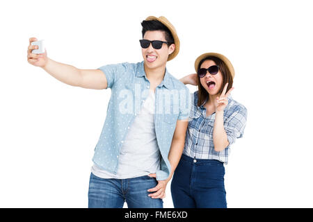 Glückliches junges Paar unter einem selfie Stockfoto