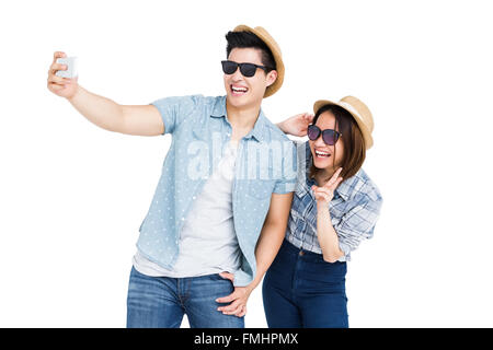 Glückliches junges Paar unter einem selfie Stockfoto