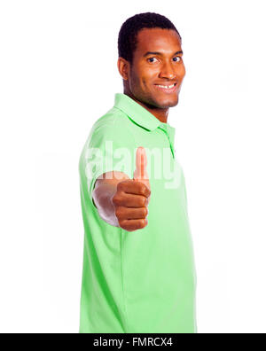 Lässige Jüngling Daumen hoch und schaut in die Kamera, isoliert auf weißem Hintergrund Stockfoto