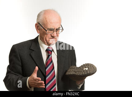 alten senior Geschäftsmann trat in Kaugummi Stockfoto