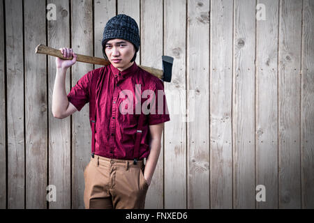 Das zusammengesetzte Bild im Hipster mit einem Ax Stockfoto