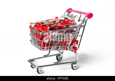 Einkaufswagen voller Rätsel-Stücke Stockfoto