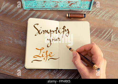 Handgeschriebener Text SIMPLIFY YOUR LIFE, Business-Erfolg-Konzept Stockfoto