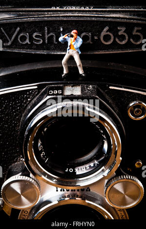 Fotograf-Figur auf einer Fotokamera, Fotografie-Konzept Stockfoto
