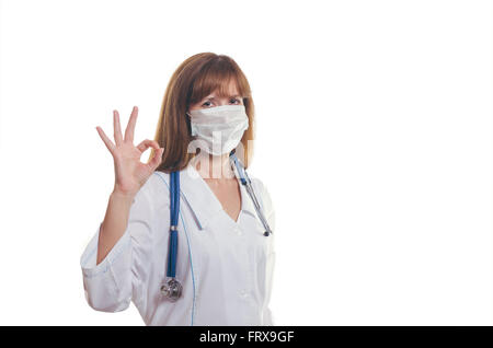 Der Arzt in einer Maske zeigt "OK" Stockfoto
