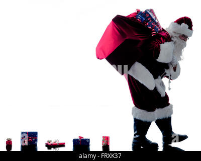 ein Weihnachtsmann Mann Walking Silhouette isoliert auf weißem Hintergrund Stockfoto