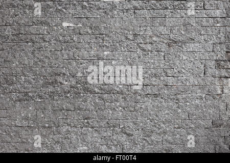 Alte graue Ziegel Wand mit hohem Detailgrad Stockfoto