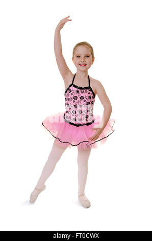 Lächelnde Kinder Ballerina führt Tendu in Erwägung Tutu Kostüm Stockfoto