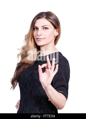 Junge schöne Frau zeigt OK Sign. Stockfoto