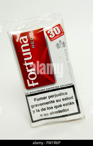 Fortuna Rote Hand Rollen Tabak Stockfoto