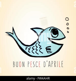 ein blaues Bütten Fisch befestigt mit Klebeband und Text Buon Pesce d Aprile, glückliche Aprilscherz Tag in italienischer Sprache Stockfoto