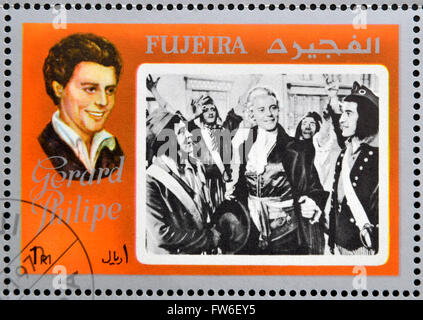 FUJEIRA - ca. 1972: Briefmarke gedruckt in Fujeira zeigt Schauspieler Gérard Philipe, ca. 1972 Stockfoto