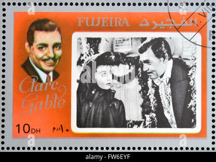 FUJEIRA - ca. 1972: Briefmarke gedruckt in Fujeira zeigt Schauspieler Clark Gable, ca. 1972 Stockfoto