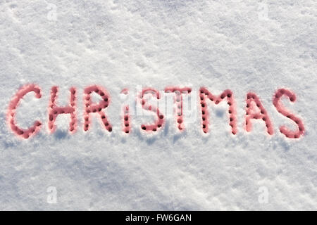 Geschriebene Worte Weihnachten auf ein Schneefeld, Neujahr-Konzept. Stockfoto