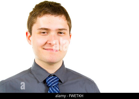 Eine junge Erwachsene Studentin ist in der Studio-gegen einen isolierten weißen Hintergrund beim tragen ein graues Hemd fotografiert. Stockfoto