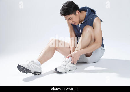 Mann Schmerzen im Sprunggelenk Stockfoto