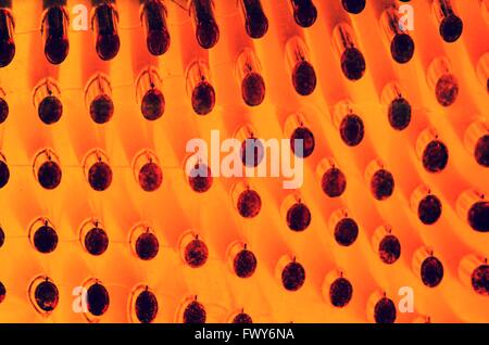 Abstract orange Textur Hintergrund mit schwarzen Punkten Stockfoto