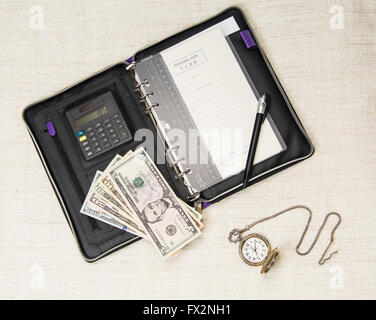 Business-Konzept der Veranstalter, der Dollar und der Uhr Stockfoto