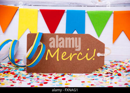 Label mit Party Dekoration, Text Merci Mittel danke Stockfoto