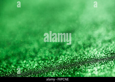 Grün Glitter Oberfläche mit grünes Licht Bokeh - es kann verwendet werden, für den Hintergrund für besondere Anlässe-Promotion-Kampagne oder Produkt Stockfoto
