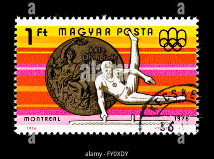 Briefmarke aus Ungarn, die Darstellung einer Turnerin am Pauschenpferd, ausgestellt für den Olympischen Spielen 1976 in Montreal. Stockfoto