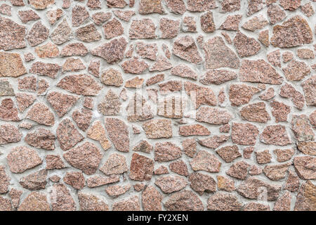 Steinmauer (Zaun). Nahaufnahme Bild von Ziegeln. Stockfoto