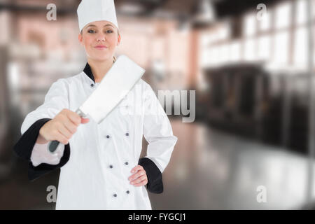 Zusammengesetztes Bild des Porträts von Köchin mit Fleischerbeil Stockfoto