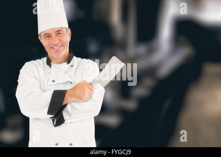 Zusammengesetztes Bild des Mannes in Chef einheitliche Fleischerbeil holding Stockfoto