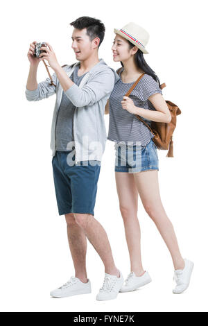 Glückliches junges Paar Reisen mit Kamera Stockfoto