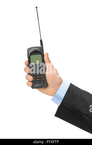 Hand mit Retro-Handy Stockfoto