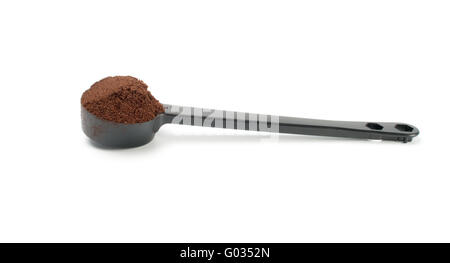 Kaffee im weißen Kunststoff Spoonon Hintergrund Stockfoto