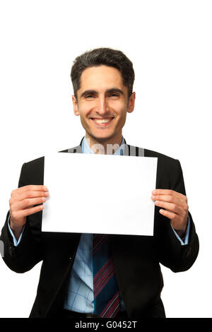 Junger Geschäftsmann zeigt die Werbung. Stockfoto