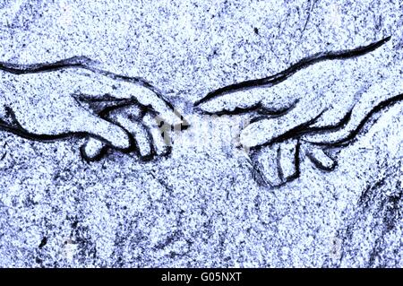 Michelangelos Erschaffung des Adam in blauer Stein Stockfoto