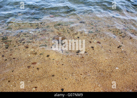 dem Hintergrund der Sand am Strand Stockfoto