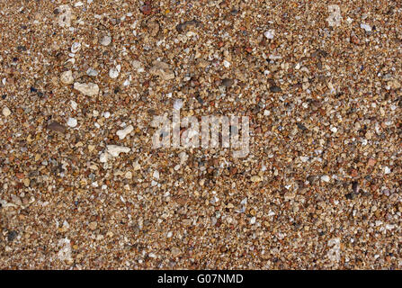 Die Textur der Sand mit Steinen für Hintergrund Stockfoto