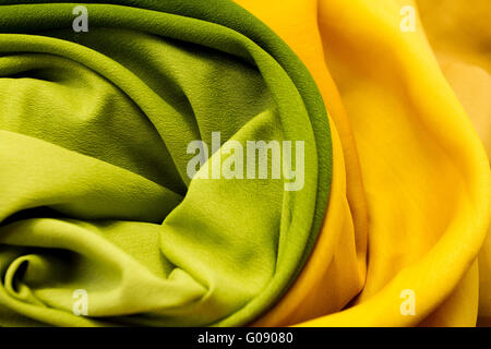 Golden and green satin textile background (close up) Stockfoto