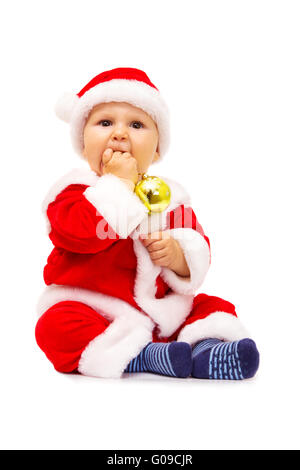 Kleiner Weihnachtsmann mit Spielzeug und Kugeln in Händen Stockfoto