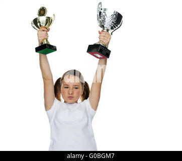 Junge weibliche Champion Trophy Anhebung Stockfoto