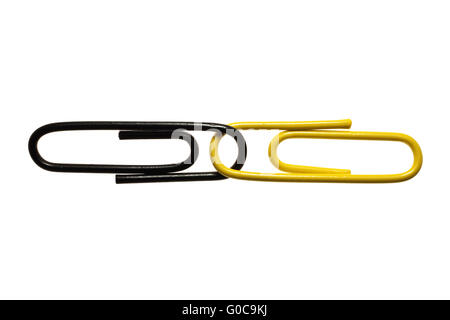 Schwarz und gelb Büroklammern, symbolisches Bild Stockfoto