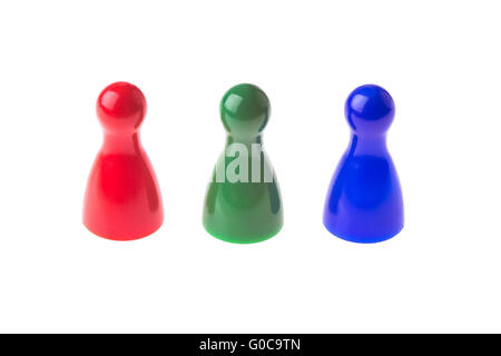 Drei Spiel Bauern hintereinander in verschiedenen Farben Stockfoto