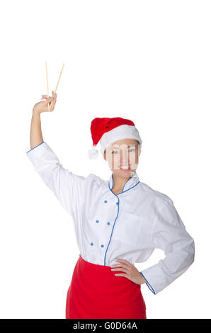 Asiatisch in Santa Claus Hüte aufgehalten Stäbchen Stockfoto