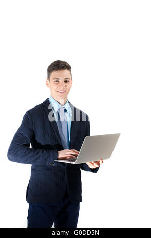 Glückliche Schüler Teenager auf Laptop in weißen Hintergrund isoliert Stockfoto