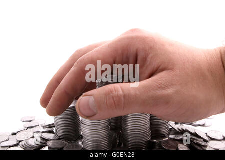 Hand, die Münzen hinzufügen Stockfoto