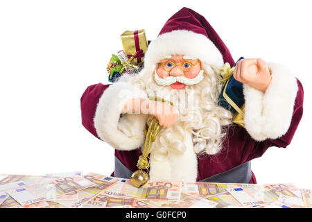 Modell der Weihnachtsmann mit Geschenken und Euro-Geld Stockfoto